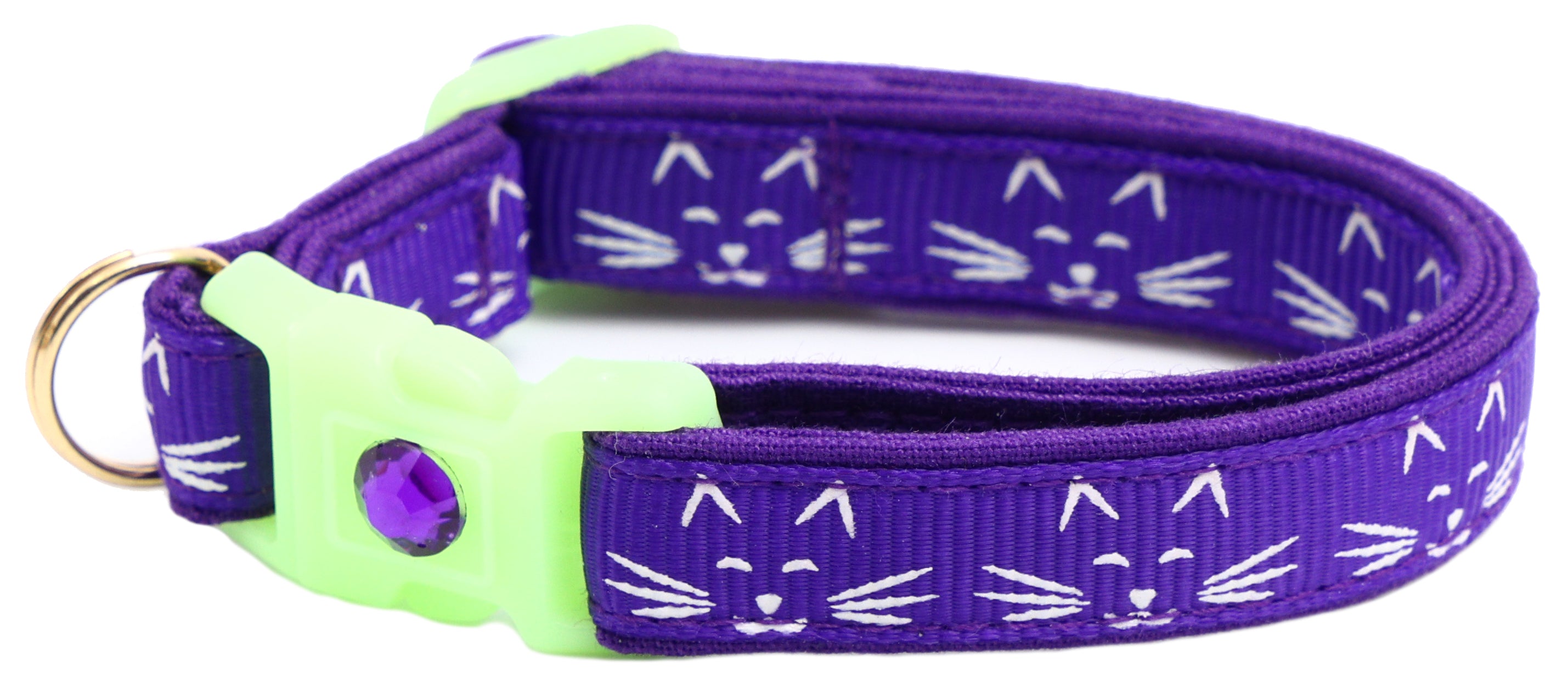 A glowing cat faces breakaway collar made of reinforced cotton, featuring a bell and charm, perfect for nighttime visibility.